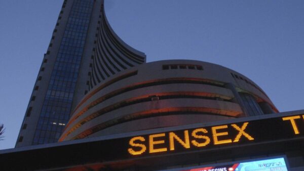 Sensex, Nifty settle almost flat in lacklustre trade